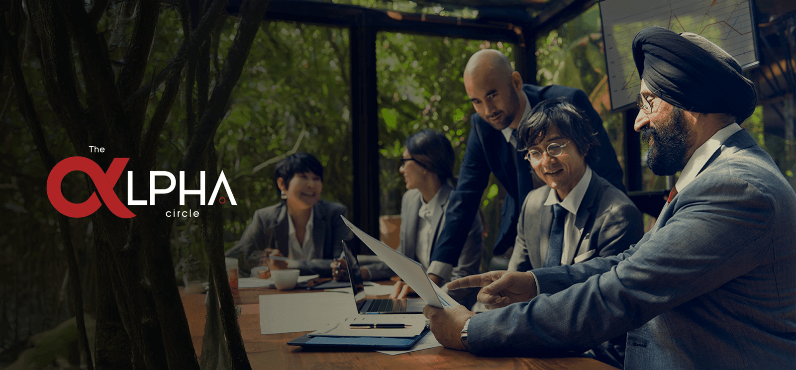 Business meeting illustration with professionals discussing documents, featuring The Alpha Circle logo.